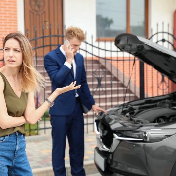 best extended car warranty service provider autopom! couple in front of car car breakdown open hood man on the phone calling for help